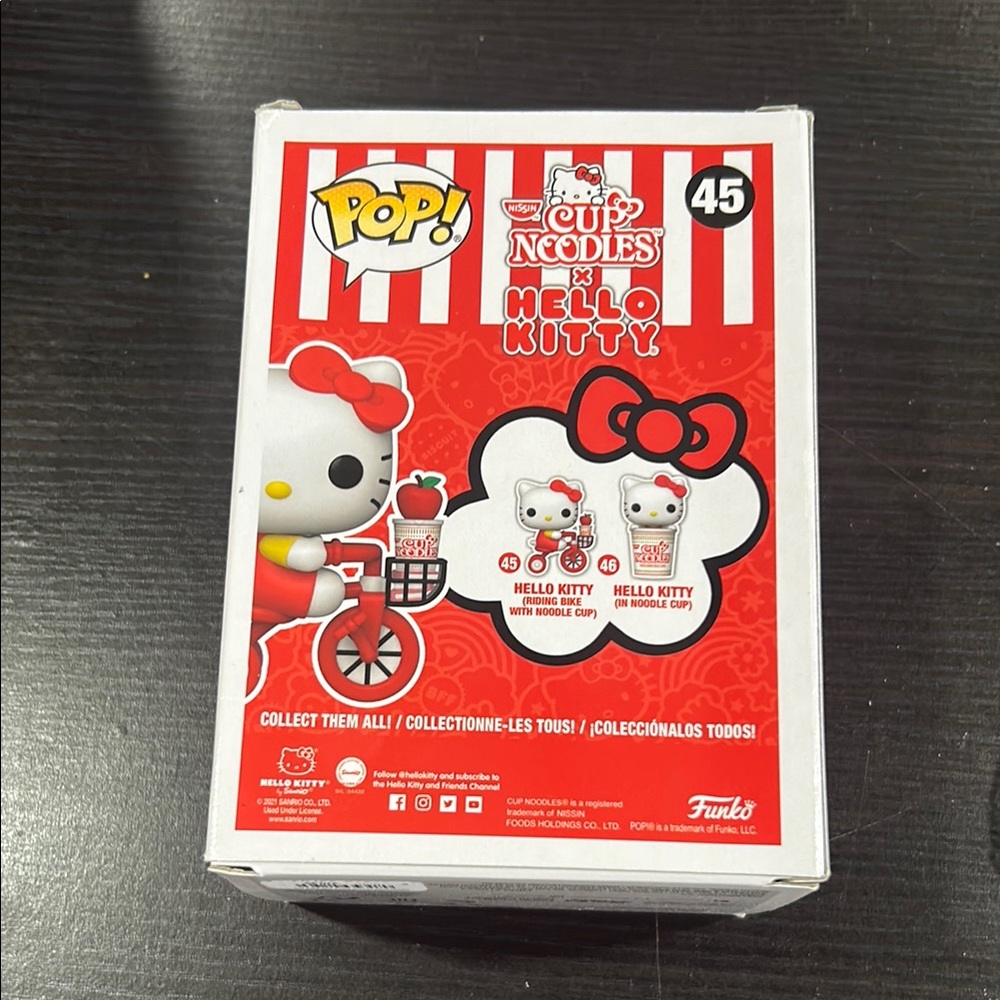 Hello Kitty Riding Bike Vinyl Figure - Picture 3 of 4